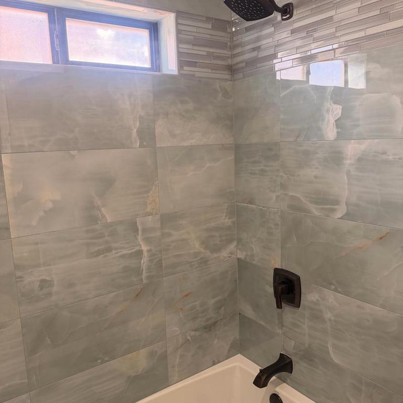 Shower valve and tub faucet with tiled walls