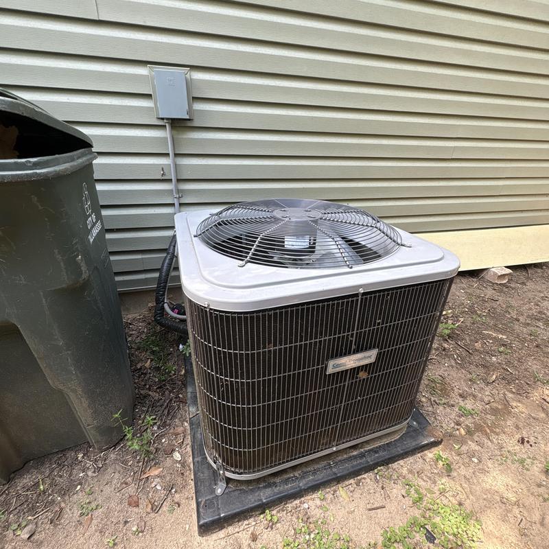 Central air conditioning unit exterior coil and fan blades