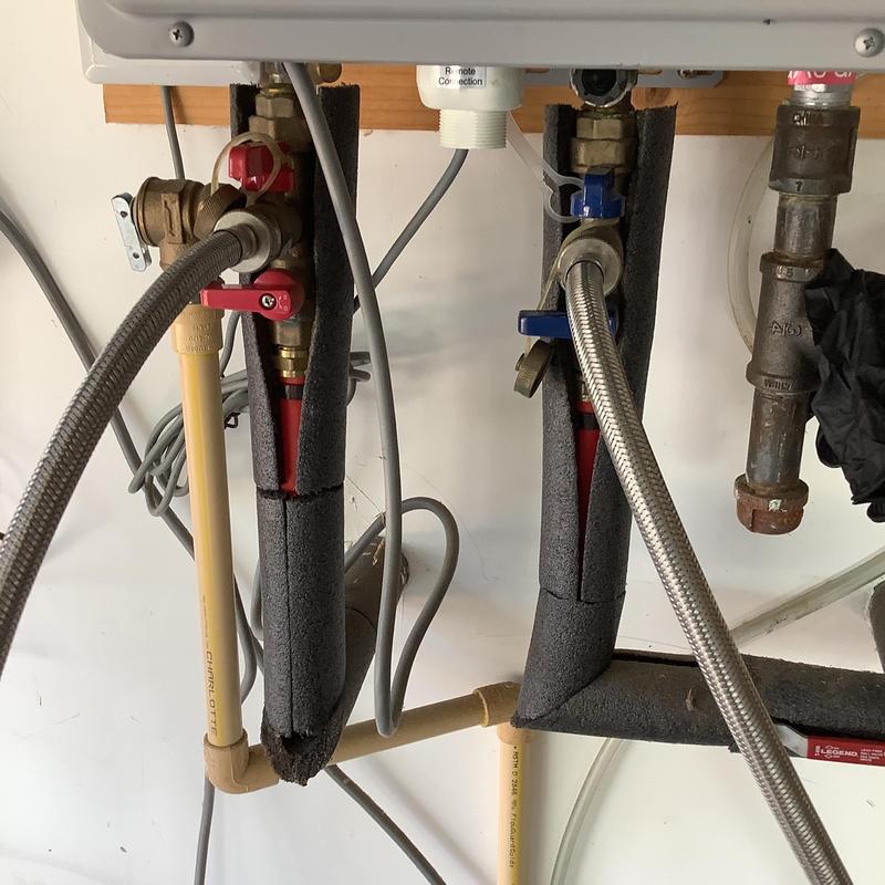 Ruud tankless water heater piping and valves in garage Ruud tankless water heater piping and valves in garage