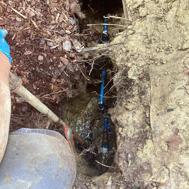 PEX water pipe repair in flower bed excavation PEX water pipe repair in flower bed excavation
