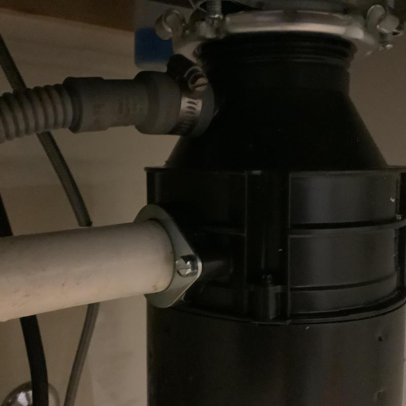 Garbage disposal unit with connected drain pipes Garbage disposal unit with connected drain pipes