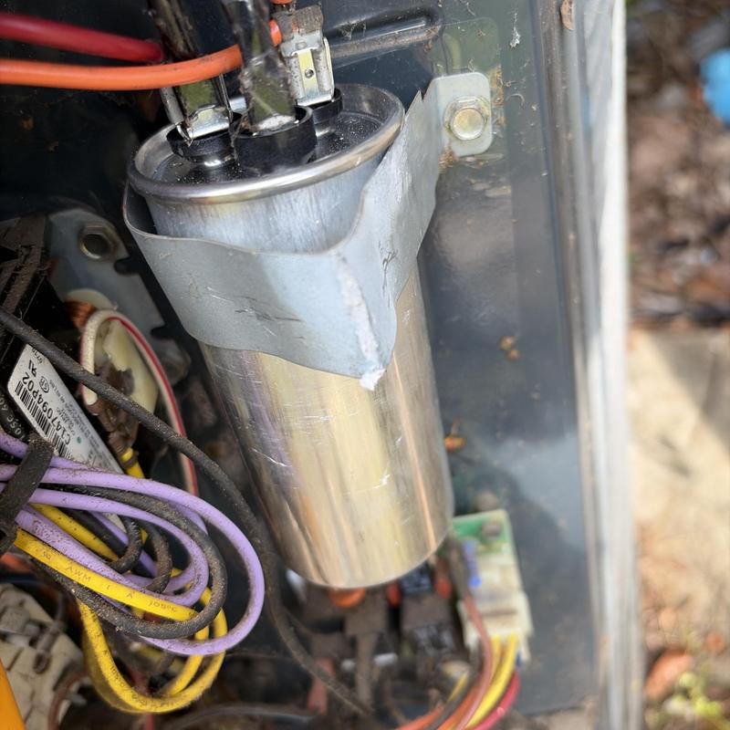 HVAC system capacitor installed and secured in unit HVAC system capacitor installed and secured in unit
