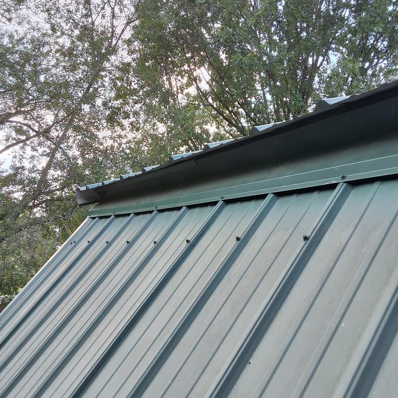 Metal roof trim removal on residential roof edge Metal roof trim removal on residential roof edge