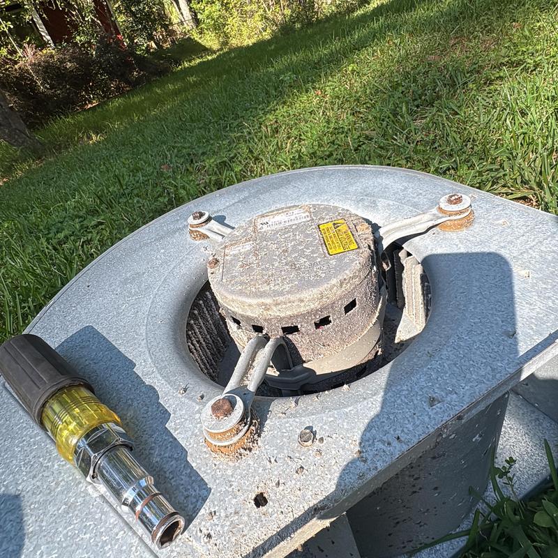 Blower motor unit on HVAC system with screwdriver nearby