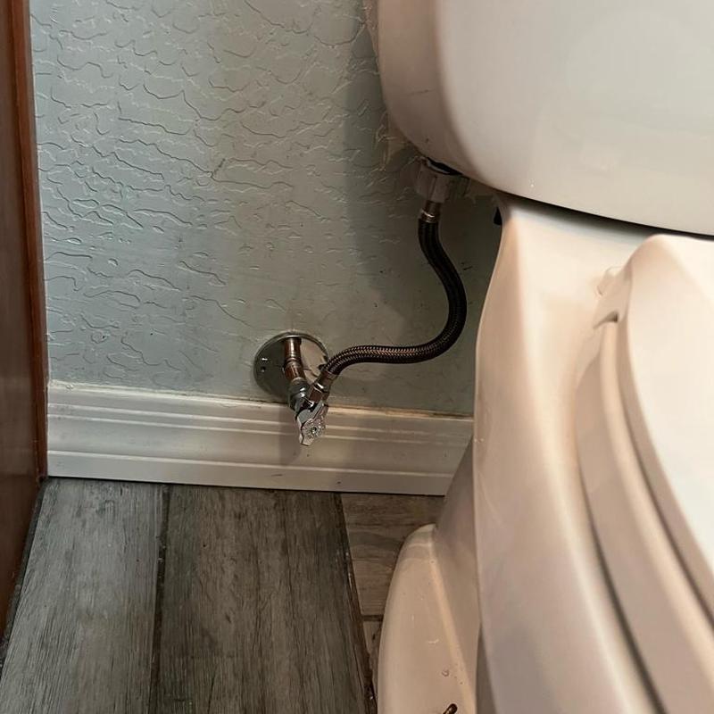 Toilet water line angle stop installation in bathroom