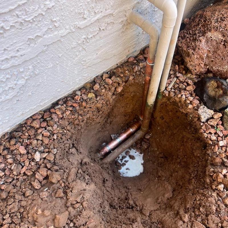 Copper water line cut and replaced near foundation wall