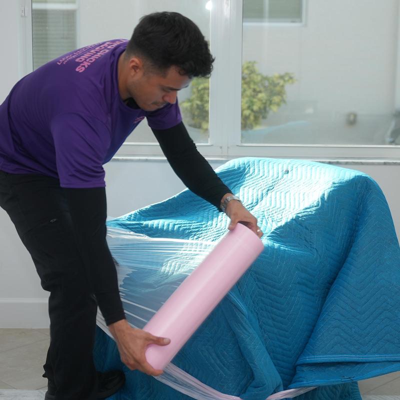 Furniture wrap with plastic and moving blanket