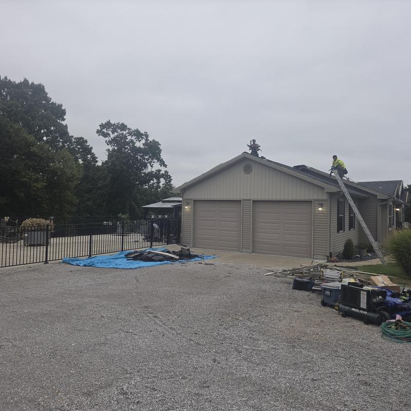 Standing seam metal roofing installation on residential home