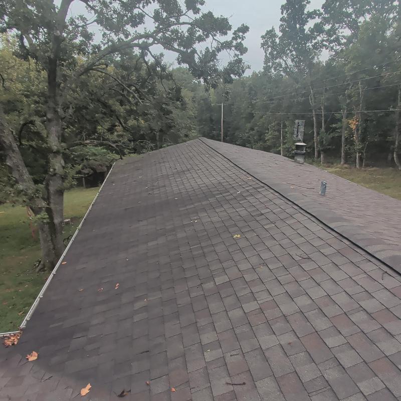 Asphalt shingle roof aging with minor leak inspection
