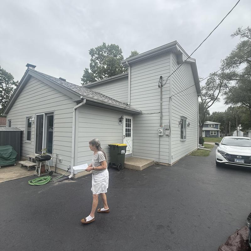 Insulated composite siding and soffit on residential home