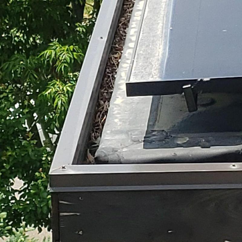 Gutter with debris and corner joint leakage Gutter with debris and corner joint leakage