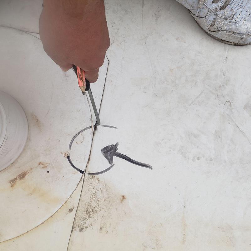 TPO flat roof seam with pry tool and marking arrow TPO flat roof seam with pry tool and marking arrow
