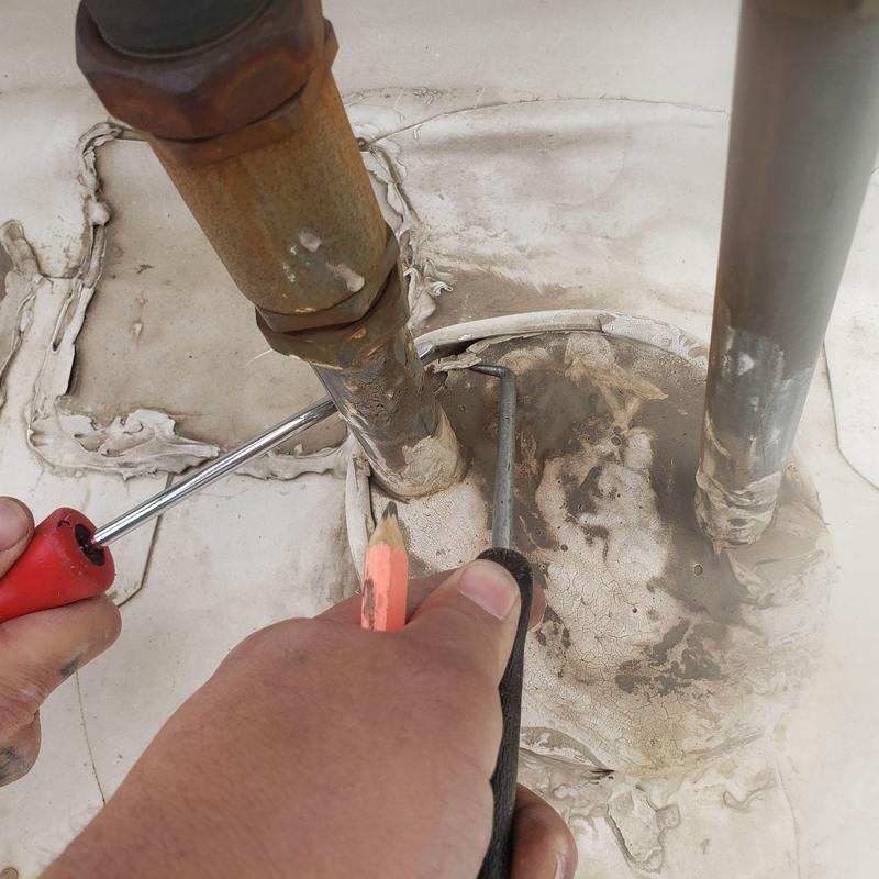 TPO roofing pipe boot with detached seams and repairs TPO roofing pipe boot with detached seams and repairs