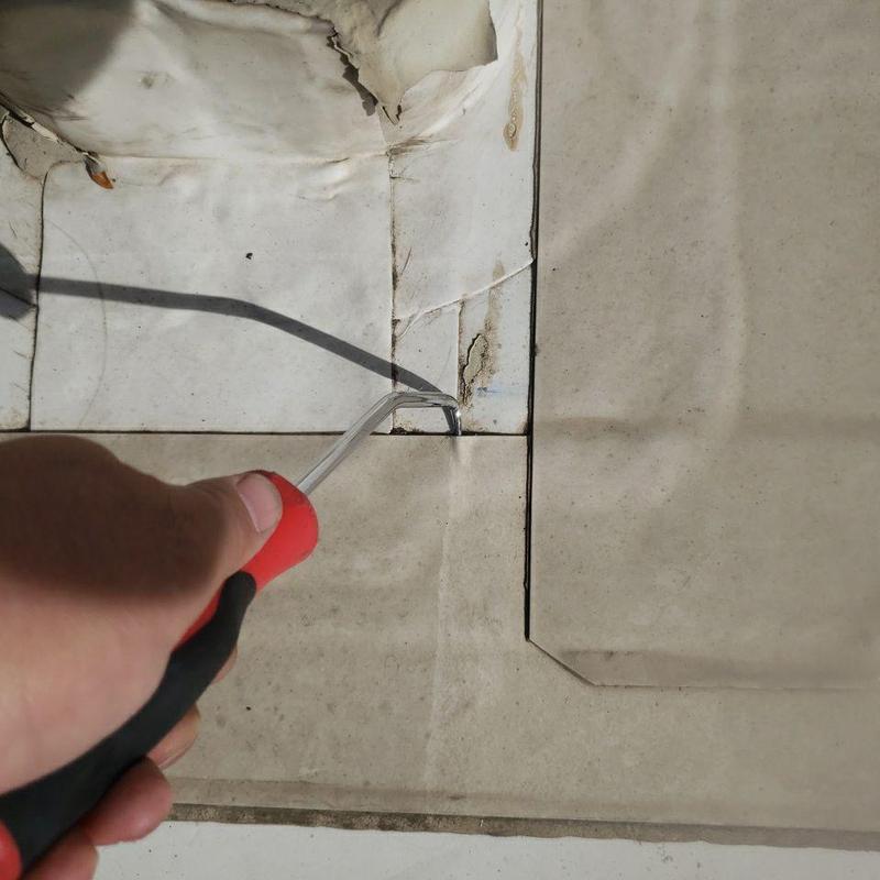 TPO flat roof seam with detached corner and damage TPO flat roof seam with detached corner and damage