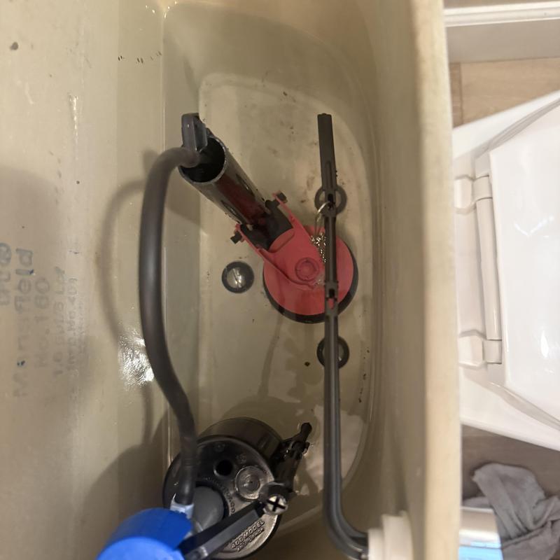 Flush valve and fill valve inside toilet tank