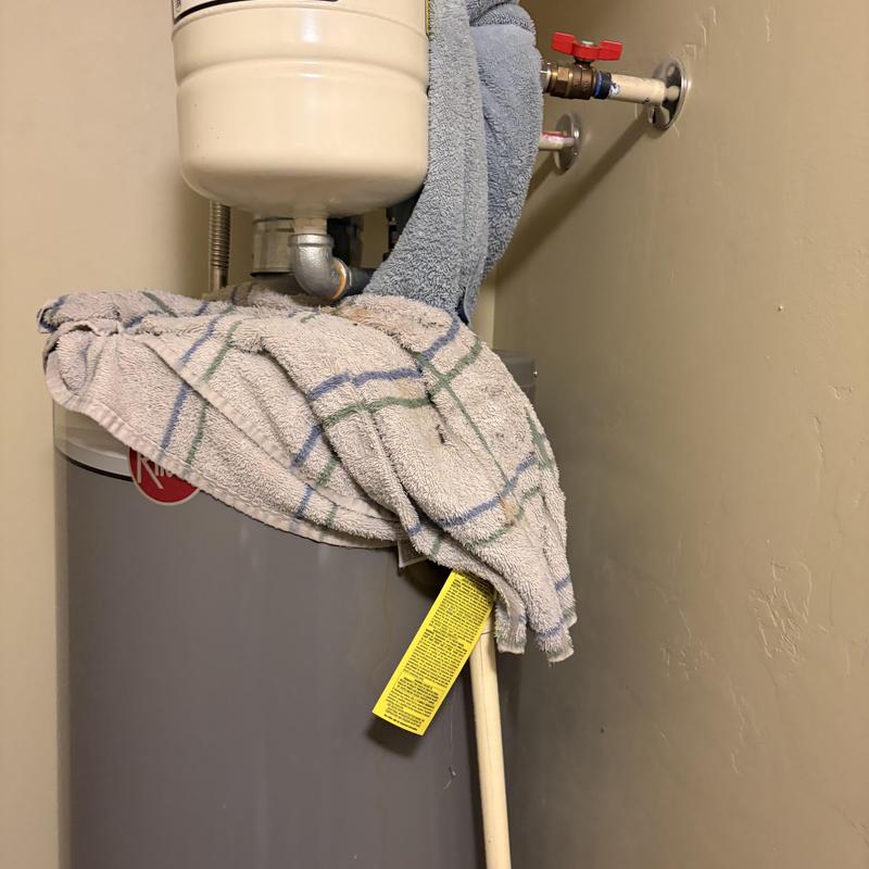 Water heater with leak repair towels and expansion tank Water heater with leak repair towels and expansion tank