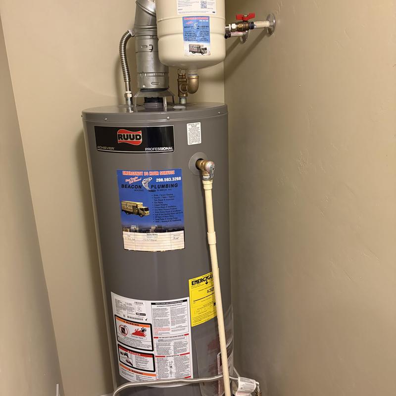 Water heater with pressure relief valve and piping Water heater with pressure relief valve and piping