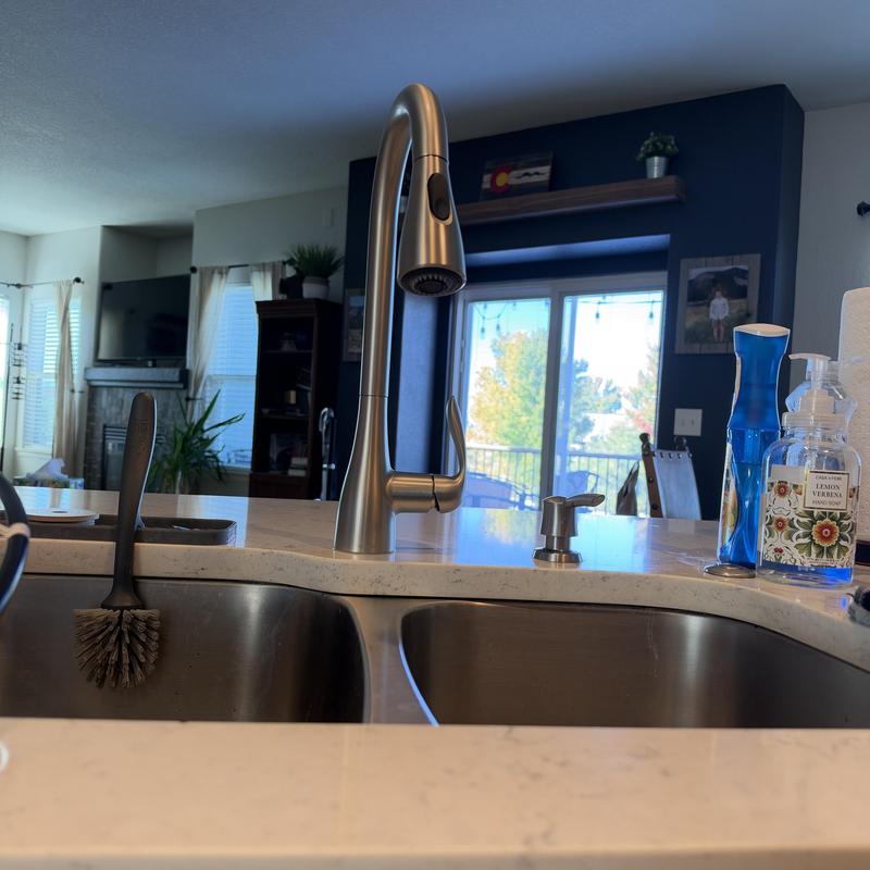 Kitchen faucet with pull-down sprayer on countertop