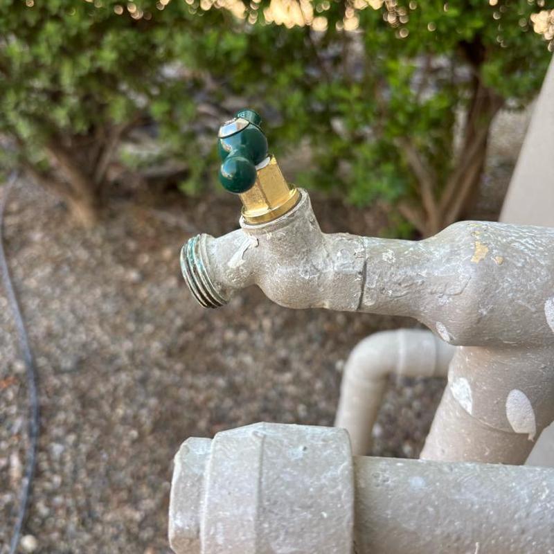 Hose bib with new brass top installed outdoors
