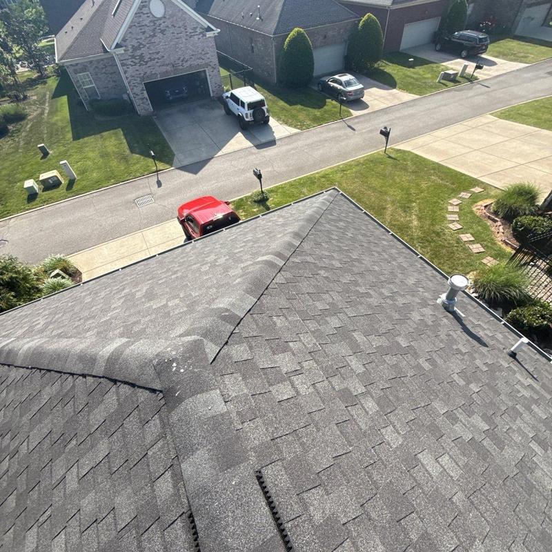 Asphalt shingle roof with hail damage inspection