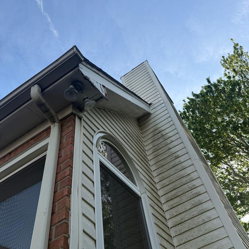 Soffit and fascia damage on home exterior corner