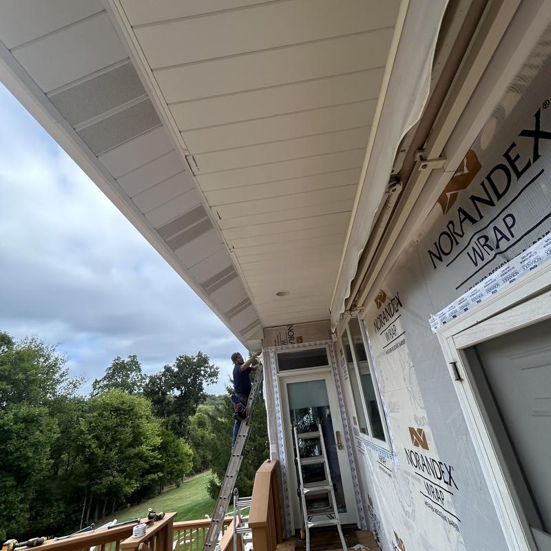 Metal soffit installation with siding replacement