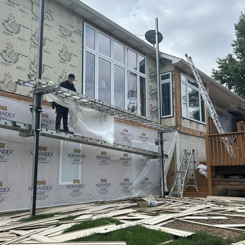 Vinyl siding removal and metal soffit replacement