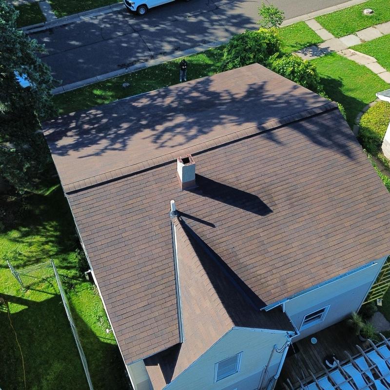Asphalt shingle roof with chimney in Duluth MN