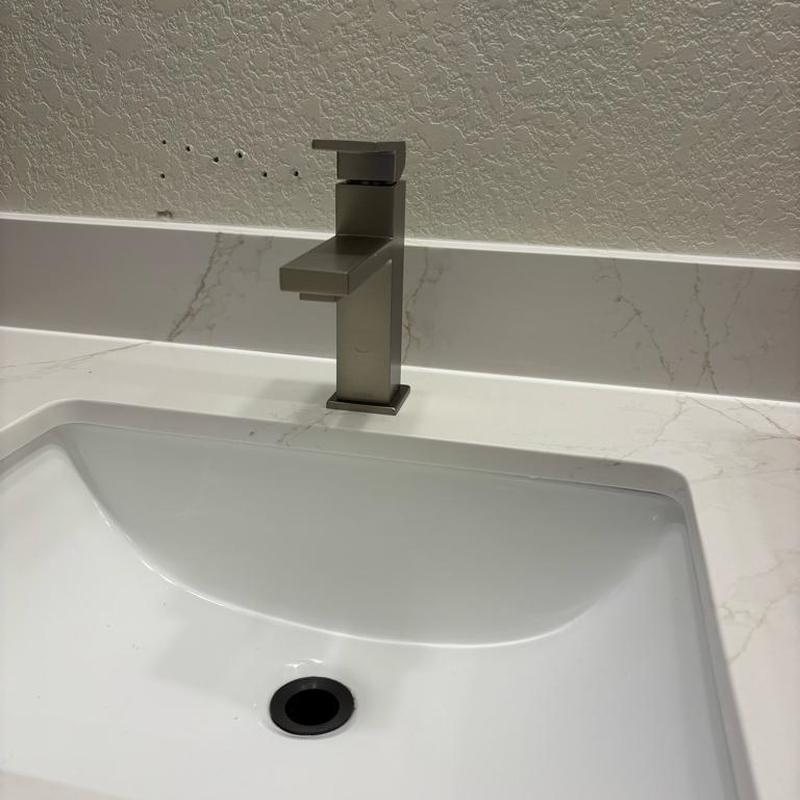 Lavatory faucet installation on marble countertop
