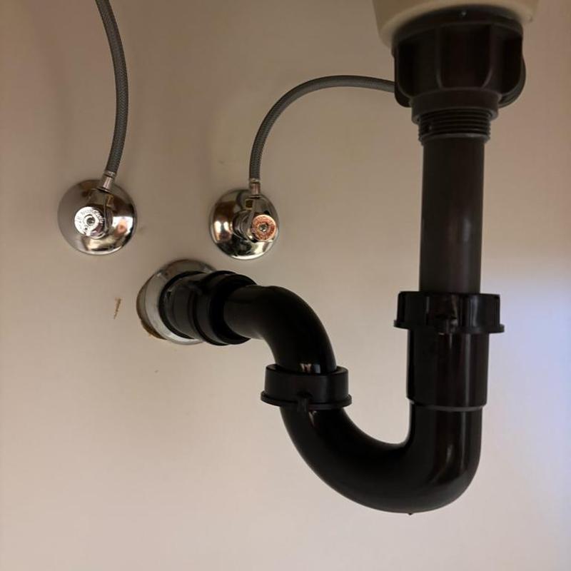 PVC sink drainage pipe with angle stops under sink