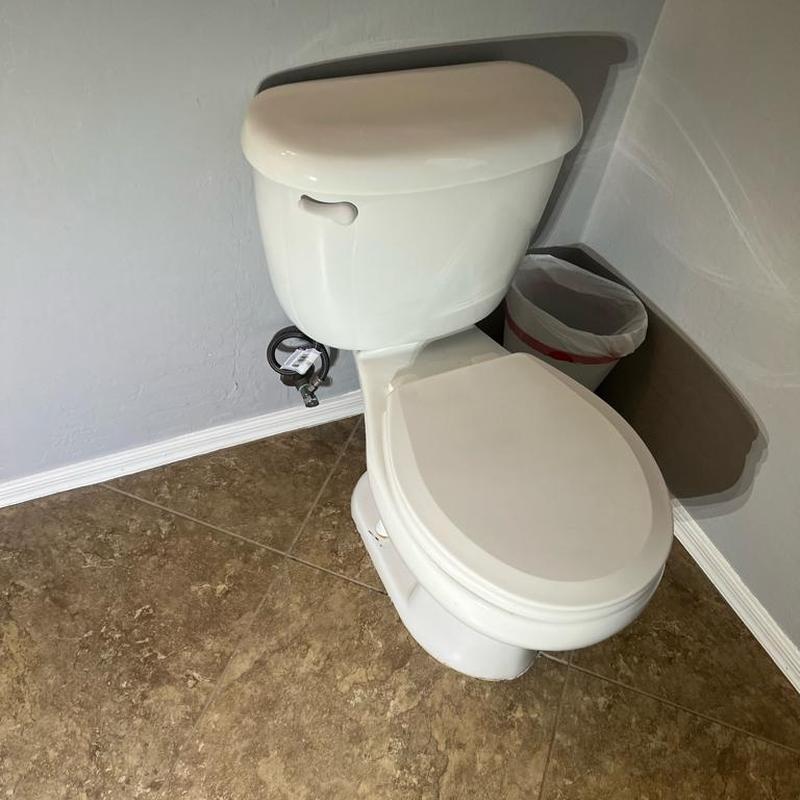 Toilet replacement with Toto model and old seat installed