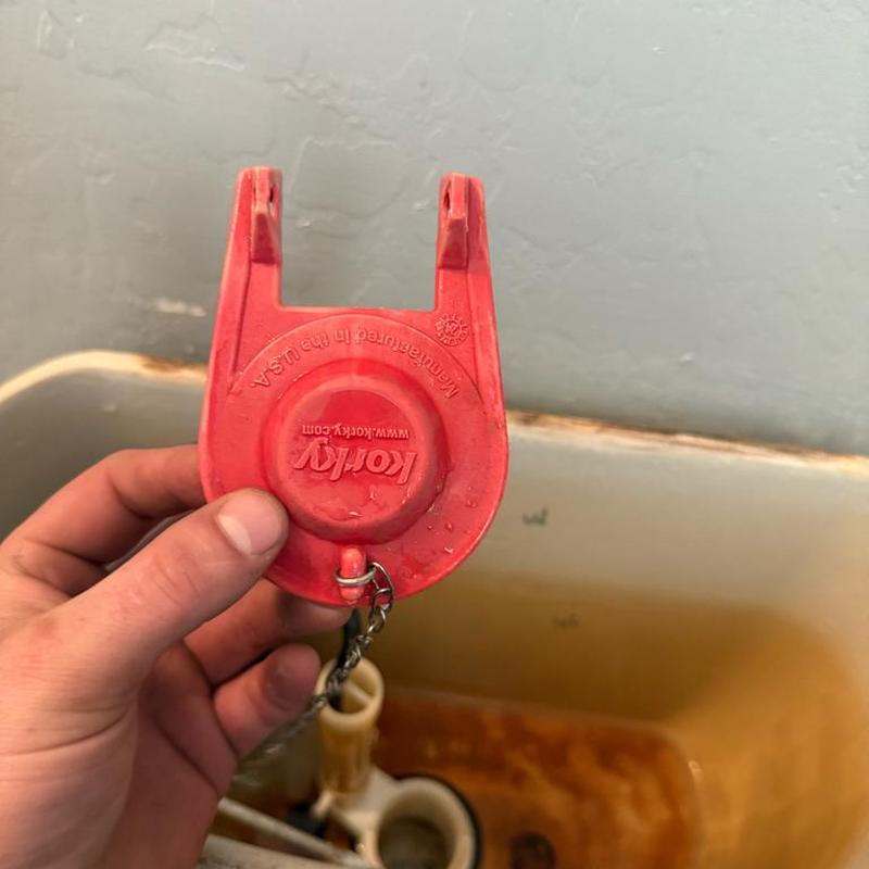 Toilet flapper valve removal in toilet tank