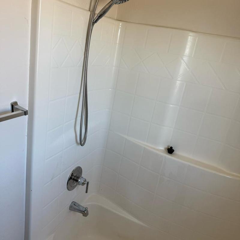 Shower valve and trim with handheld showerhead