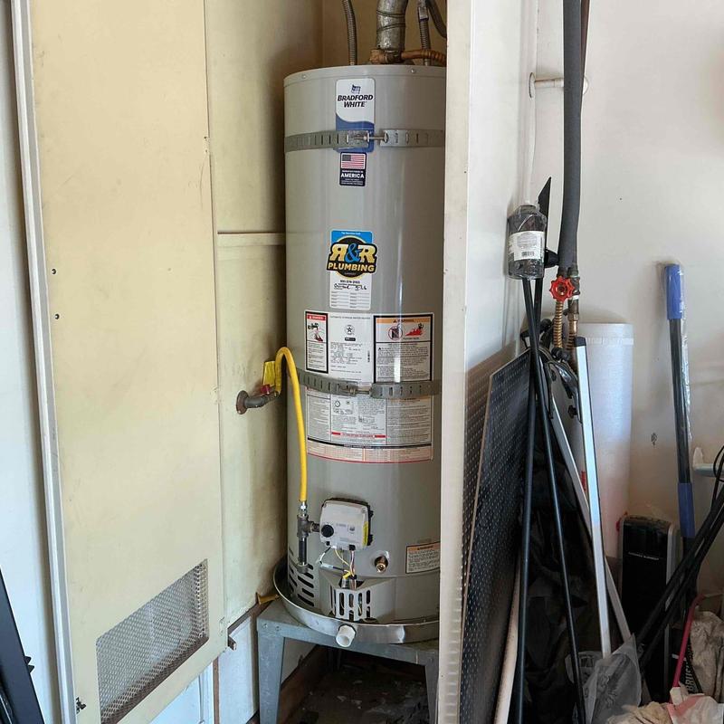 Bradford White water heater installed in utility room