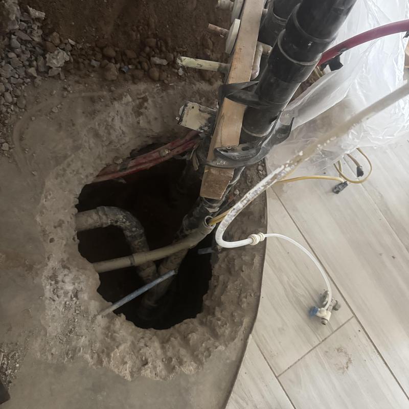 Post-tension slab with exposed plumbing and damaged cable Post-tension slab with exposed plumbing and damaged cable