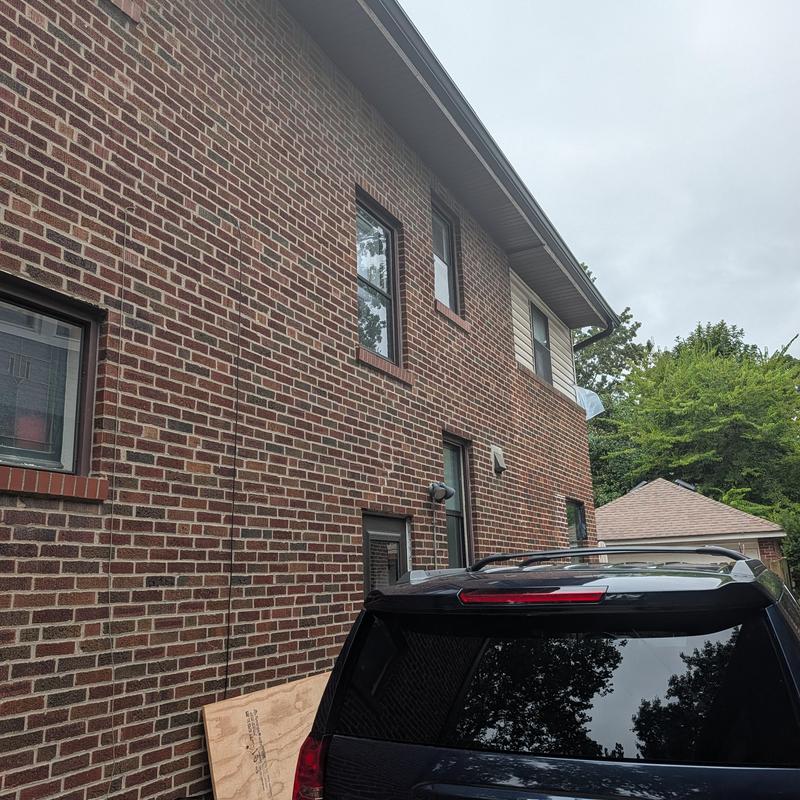 Vinyl siding and z flashing behind brick correction