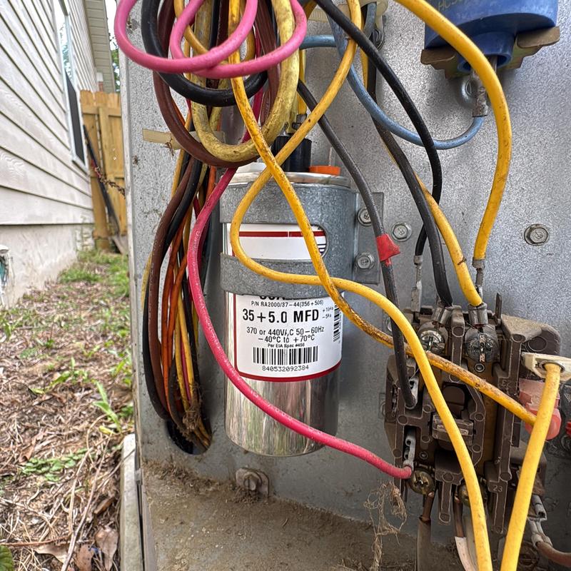 AC capacitor and wiring inside outdoor HVAC unit