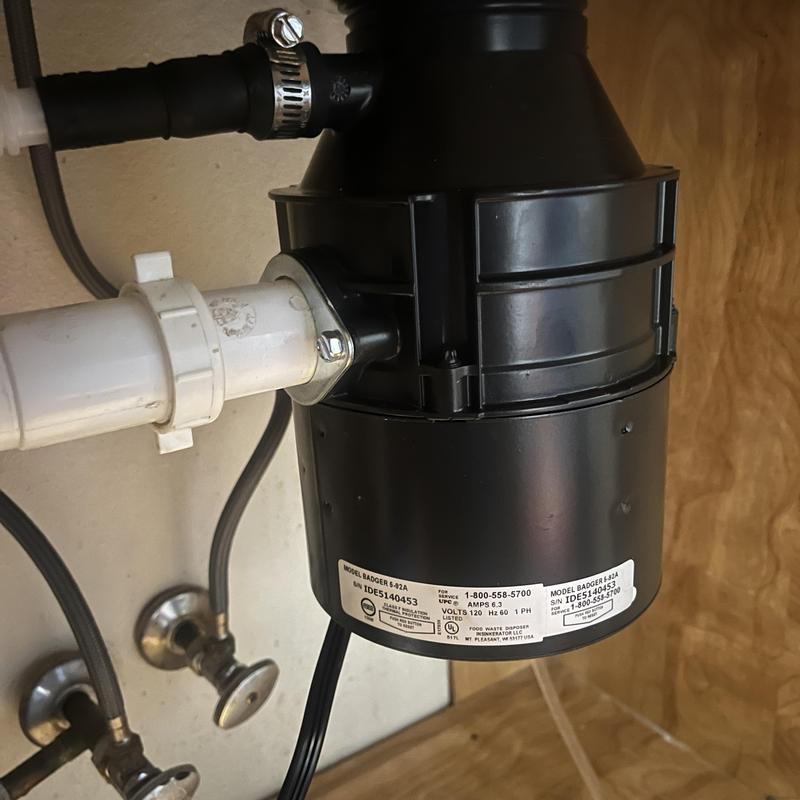 Garbage disposal and strainer installation under sink