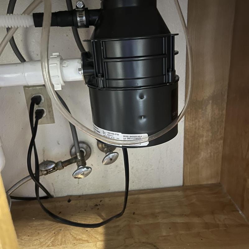 Garbage disposal motor and strainer installation under sink