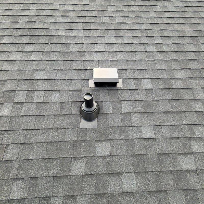 Tamko Titan XT roof shingles with vent pipe and vent cap Tamko Titan XT roof shingles with vent pipe and vent cap