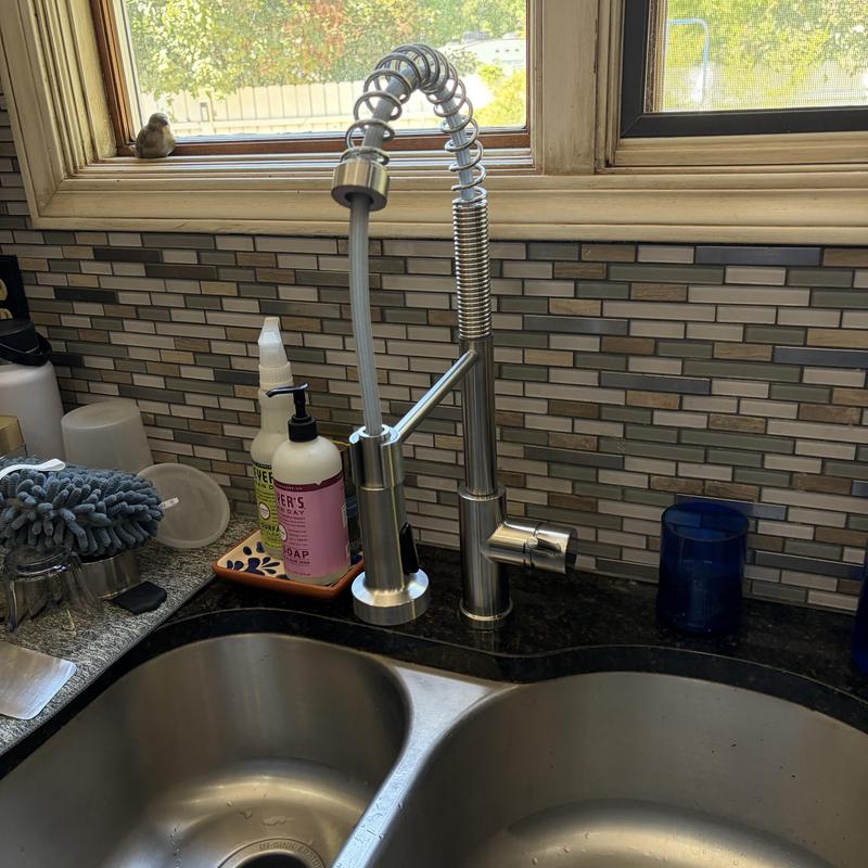 Kitchen faucet with spring spout installation near window
