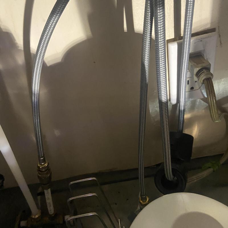 Kitchen faucet supply lines under sink near outlet