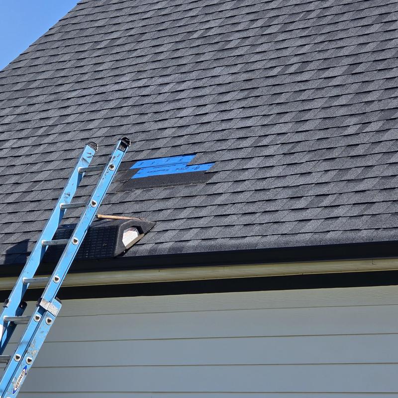 Asphalt shingles with temporary patch and ladder Asphalt shingles with temporary patch and ladder