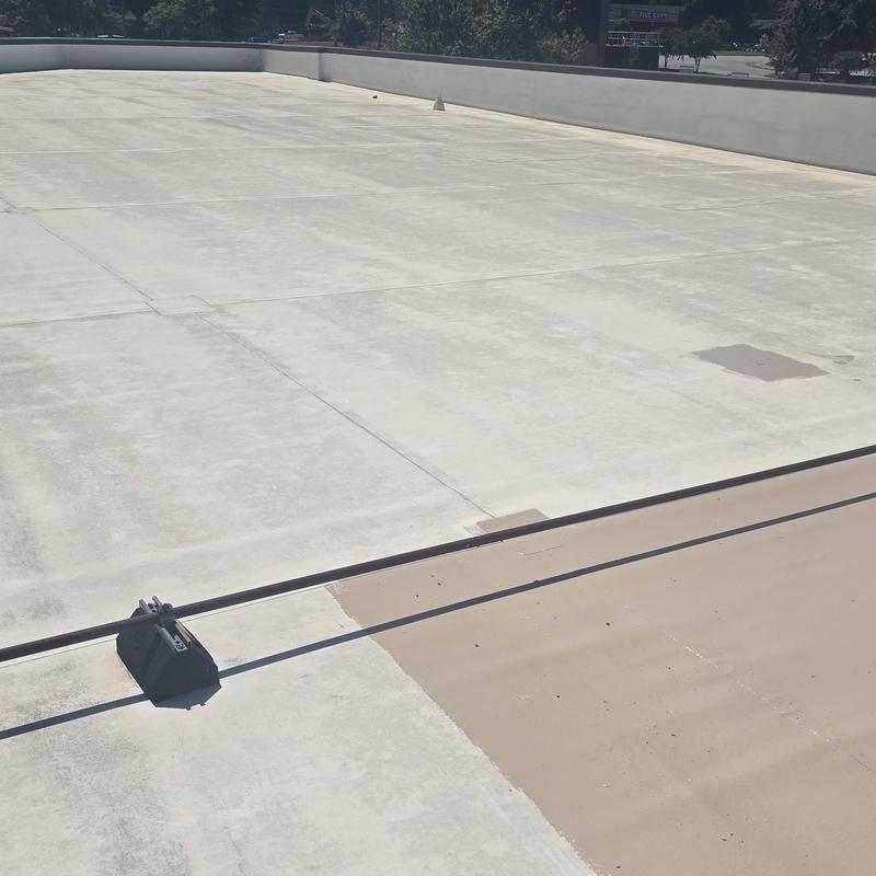 TPO roof with silicone restoration coating patches TPO roof with silicone restoration coating patches