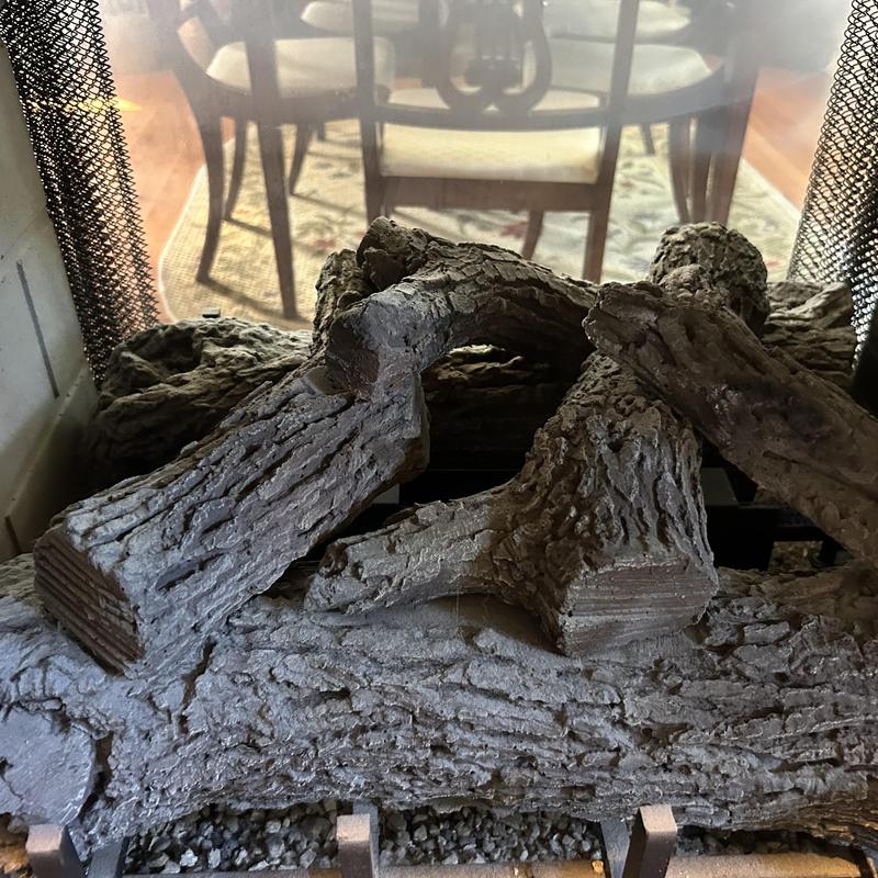 Gas fireplace ceramic logs with restored function