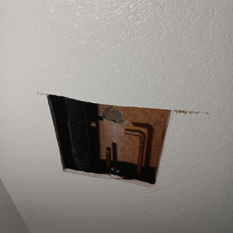 Shower valve supply line exposed in ceiling hole Shower valve supply line exposed in ceiling hole
