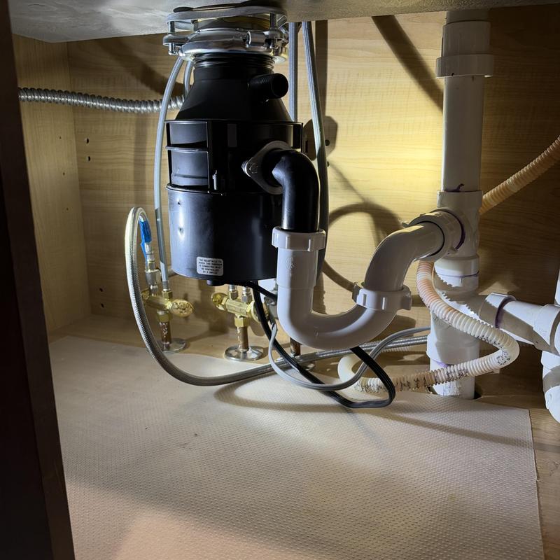 Garbage disposal installation and drain plumbing under sink