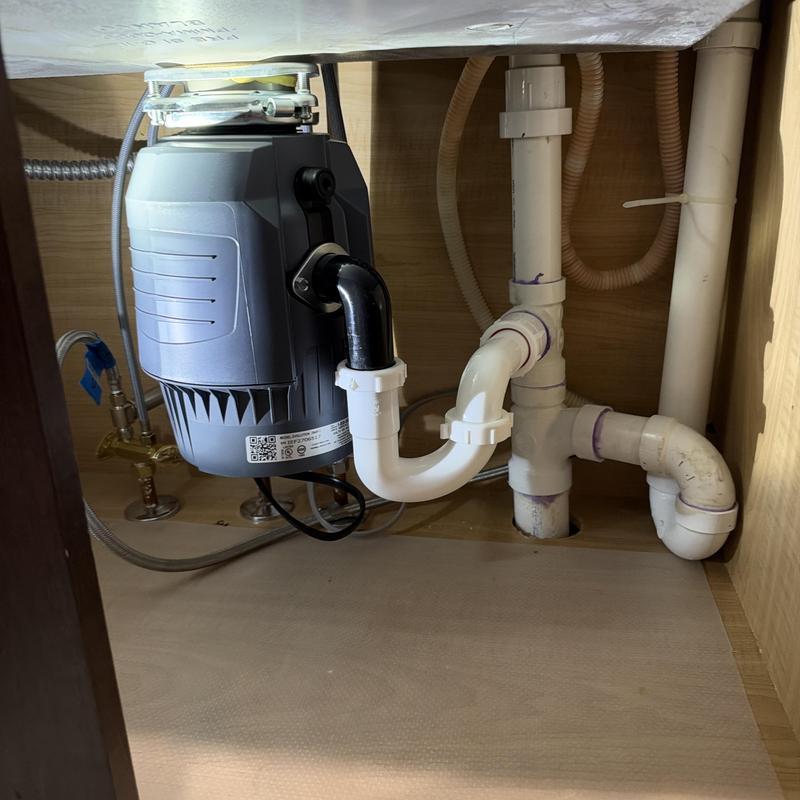 Garbage disposal and drainage piping under sink