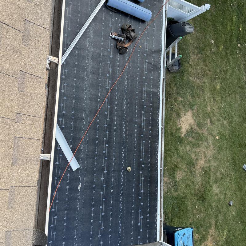 Modified bitumen roofing installation on flat roof section Modified bitumen roofing installation on flat roof section
