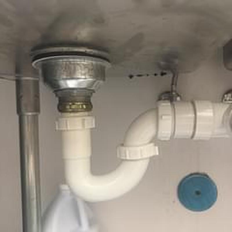 Basket strainer and PVC drain pipe under kitchen sink